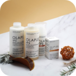 Hair treatment creams and strengthening products arranged for clean commercial product photography.