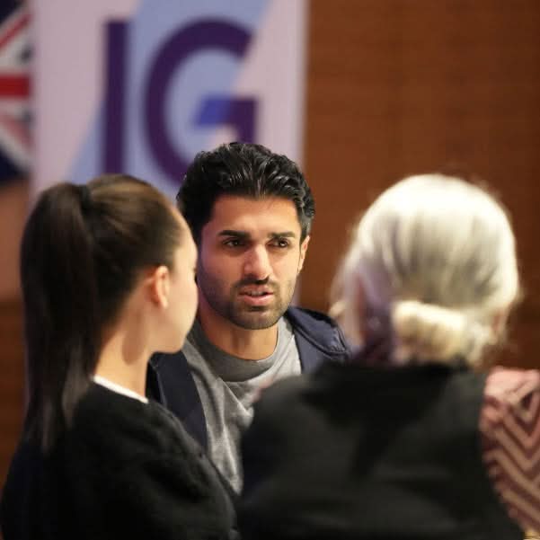 Guests speaking together during a busy corporate networking event